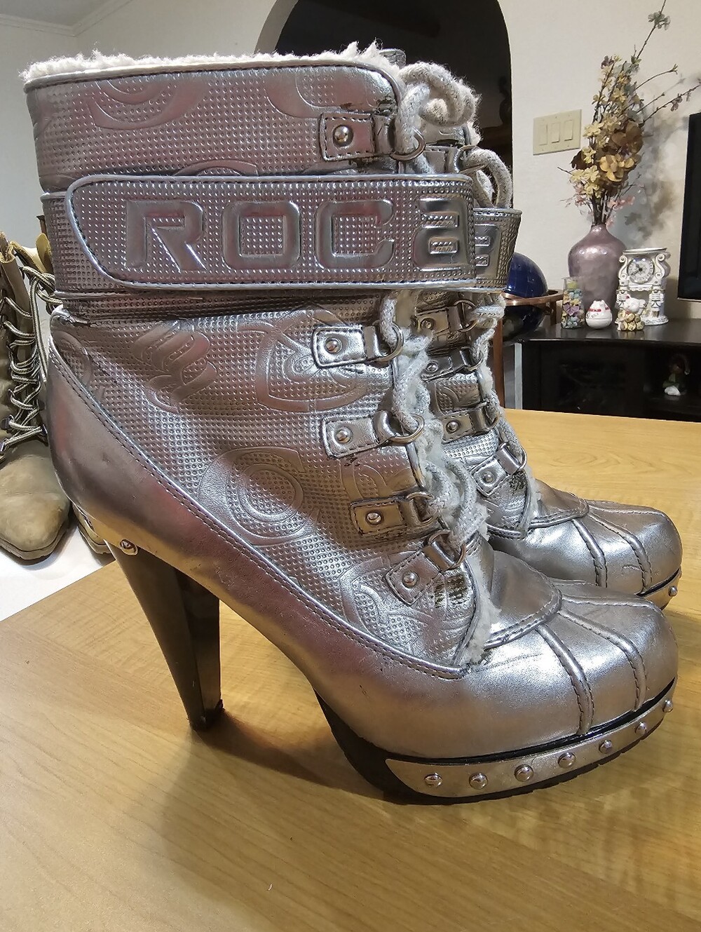 2007 Y2K Roca Wear silver metallic platform boots with metal plates.